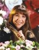 Mayim Bialik smiling in Portrait with Flowers Photo Print - Item # VARCEL682100