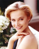 Josie Bissett Showing Her Smile and Her Earrings in a Portrait Photo Print - Item # VARCEL682142