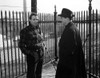 Marlon Brando standing and Talking to a Man Inside a Fence Photo Print - Item # VARCEL682626