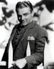 James Cagney wearing a suit behind a fence Photo Print - Item # VARCEL683219
