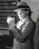 Film still of James Cagney smoking a cigarette and wearing a fedora Photo Print - Item # VARCEL683251