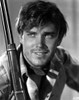 Jeffrey Hunter holding a rifle Photo Print - Item # VARCEL683389