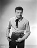 Brian Keith wearing a neck ribbon and a holster Photo Print - Item # VARCEL683429