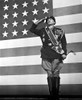 George C Scott saluting in front of an American flag Photo Print - Item # VARCEL683739