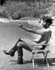George Hamilton shirtless beside a lake Photo Print - Item # VARCEL683795