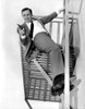 Film still of Robert Vaughn carrying a pistol Photo Print - Item # VARCEL683868