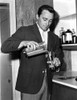 Robert Vaughn pouring a drink Photo Print - Item # VARCEL683869