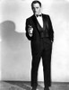 Robert Vaughn wearing a tuxedo carrying a gun Photo Print - Item # VARCEL683870