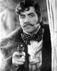 Oliver Reed holding a pistol Photo Print - Item # VARCEL683945