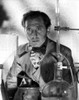 Peter Cushing with chemistry equipment Photo Print - Item # VARCEL684160