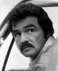 Film still of Burt Reynolds looking over his shoulder Photo Print - Item # VARCEL684171