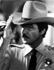 Burt Reynolds wearing a police badge and a cowboy hat Photo Print - Item # VARCEL684191