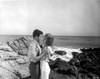 Mark Damon and a woman at the beach Photo Print - Item # VARCEL684240