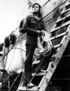 Jack Lord carrying rope and standing on the ladder of a boat Photo Print - Item # VARCEL684259