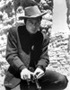 Deforest Kelly loading a gun Photo Print