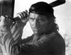 Film still of Robert Shaw carrying a knife Photo Print - Item # VARCEL684507