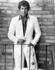 Tony Roberts wearing a suit in front of a brick wall Photo Print - Item # VARCEL684567