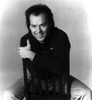 Michael Keaton smiling on a chair Photo Print - Item # VARCEL685092