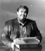 John Candy with a typewriter Photo Print - Item # VARCEL685148