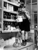 Film Still of Bob Watson standing on kitchen bench with a cookie jar Photo Print - Item # VARCEL685280