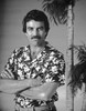 Magnum Pi standing in Floral Polo with Arm's Cross Photo Print - Item # VARCEL685339