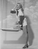 Jayne Mansfield Posed on the Swing in White Short Sleeve Collar Shirt and Black Long Sleeve Shirt with White Cuff Photo Print - Item # VARCEL685392