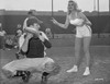 Jayne Mansfield Posed and Bent Over in White Strap Top and High Waist Shorts with Both Hands in Peace Sign Gesture Photo Print - Item # VARCEL685410