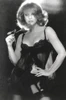 Ann-Margaret wearing lingerie and holding a rose Photo Print - Item # VARCEL685498