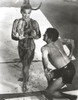 Ann-Margaret wearing a bikini beside a dancing man Photo Print - Item # VARCEL685504