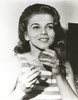 Ann-Margaret smelling perfume Photo Print - Item # VARCEL685514