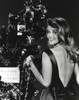 Ann-Margaret beside a Christmas tree Photo Print - Item # VARCEL685515