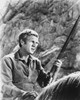 Film still of Steve McQueen with a gun Photo Print - Item # VARCEL685811