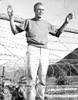 Film still of Steve McQueen with his hands up Photo Print - Item # VARCEL685823