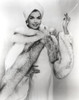 Ann Miller wearing a fur wrap while smoking Photo Print - Item # VARCEL685923