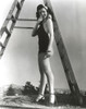 Ann Miller standing Below a Ladder in a Lingerie Classic Portrait Photo Print - Item # VARCEL685943