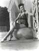 Ann Miller sitting on a Ball in a Classic Portrait Photo Print - Item # VARCEL685970