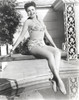 Ann Miller sitting in Lingerie Photo Print - Item # VARCEL685971