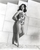 Ann Miller Leaning on a Wall wearing a Minders in a Classic Portrait Photo Print - Item # VARCEL685978