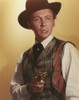 Cameron Mitchell Holding Pistol in Gray Stripes Vest Photo Print - Item # VARCEL686037