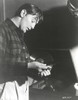 Film still featuring Robert Mitchum holding records Photo Print - Item # VARCEL686070