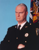 Richard Moll Frowning in Police Uniform Portrait Photo Print - Item # VARCEL686115