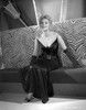 Kim Novak Siting on Couch in Black Gown Portrait Photo Print - Item # VARCEL686505
