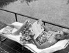 Kim Novak Lying on Bench in Flower Design Dress Photo Print - Item # VARCEL686531