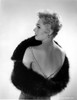 Kim Novak wearing a fur stole Photo Print - Item # VARCEL686548
