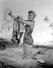 Kim Novak posing on a beach Photo Print - Item # VARCEL686546
