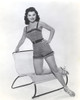 Debra Paget posing on a chair Photo Print - Item # VARCEL686792