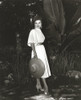 Debra Paget wearing a dress and holding a straw hat Photo Print - Item # VARCEL686799