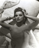 Debra Paget lying on a bed Photo Print - Item # VARCEL686795