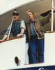 Jameson Parker standing in Brown Jacket and Blue Stripe Collar Shirt with Blue Jeans Photo Print - Item # VARCEL686808