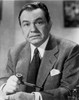 Edward Robinson Holding Pipe in Tuxedo with Handkerchief on Pocket Photo Print - Item # VARCEL687167